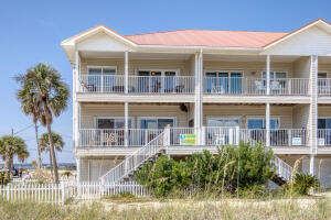 Welcome to Jensen Beach Too at Navarre Beach. This west end unit furnished townhome with designer décor is fully equipped for Vacation Home or Vacation Rental Investment and will sleep 10. Projection for investment $70K to $80K. Located directly across the street from beach access to the white sugar sand beach and emerald waters of the Gulf of Mexico. From every room you will have water views of the Gulf of Mexico or the Santa Rosa Sound. Open concept is spacious with walls of windows, great room with comfortable seating area and entry to large balcony and dining area.