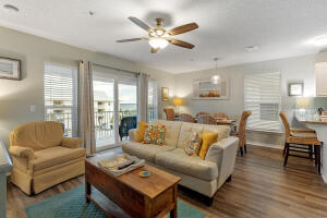 Furnished Vacation Home or Vacation Rental Investment in condominium complex with Community Pool. Sun seekers, outdoor adventurers, beach lovers and water sports enthusiasts will enjoy life at Navarre Beach in this furnished condominium located across the street from a Public Walkover to the Gulf of Mexico and walking distance to the Santa Rosa Sound. Newly updated open concept has living room, sliders to balcony, dining area, wood design flooring
